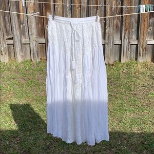 Flowy, white skirt.